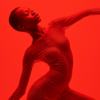 In this image, a woman is seen wearing a vibrant red bodysuit, striking a pose in front of a red background. She exudes confidence and grace as she poses for the camera, with her arms outstretched. The bold red colors of the bodysuit and background create a striking visual contrast, drawing attention to the woman''s figure and movement. The woman''s posture suggests she may be dancing or performing, adding a dynamic element to the composition. Her expression is focused and determined, adding to the sense of energy and motion captured in the photograph.
