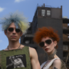 In this image, we see a man and a woman with vibrant red hair standing together. Both individuals are wearing stylish sunglasses, adding a cool and edgy vibe to their look. The man is also wearing a green shirt, while the woman has a necklace and earrings around her neck. The background shows a clear blue sky, enhancing the overall colorful and lively atmosphere of the scene. The man has a confident and relaxed posture, while the woman exudes a sense of style and charm. Overall, the image captures a fashionable and trendy couple with unique and eye-catching hair colors.
