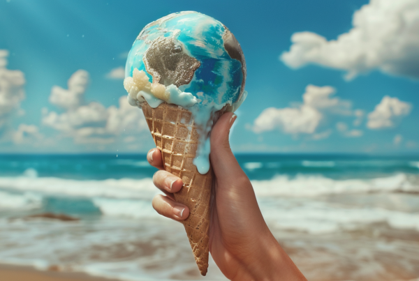 A person is standing on a beach, holding a cone of ice cream with a planet on it. The ice cream cone has a blue swirl design on it. The person''s hand is gripping the cone tightly as they enjoy their sweet treat. The sky above them is a beautiful shade of blue with fluffy white clouds scattered around. The person seems to be savoring the moment, enjoying the refreshing dessert in the warm beach setting. The colors in the image include shades of blue, brown, and green, creating a soothing and serene atmosphere