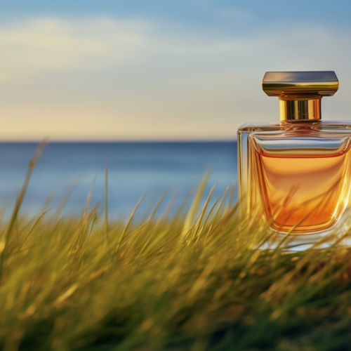 A bottle of perfume is elegantly placed on top of a grass-covered hill that overlooks a vast ocean. The scene is serene and picturesque, with the bottle standing out against the lush green grass. The ocean glistens in the background, creating a peaceful and calming atmosphere. The perfume bottle exudes luxury and beauty, contrasting with the natural elements surrounding it. This image captures the essence of relaxation and sophistication, with the bottle serving as a focal point in the tranquil setting by the sea.